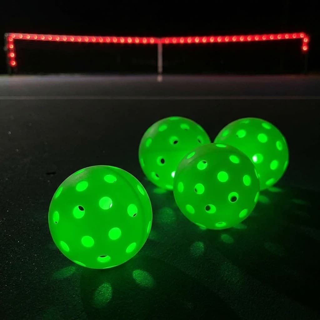 Glowing green LED pickleball balls